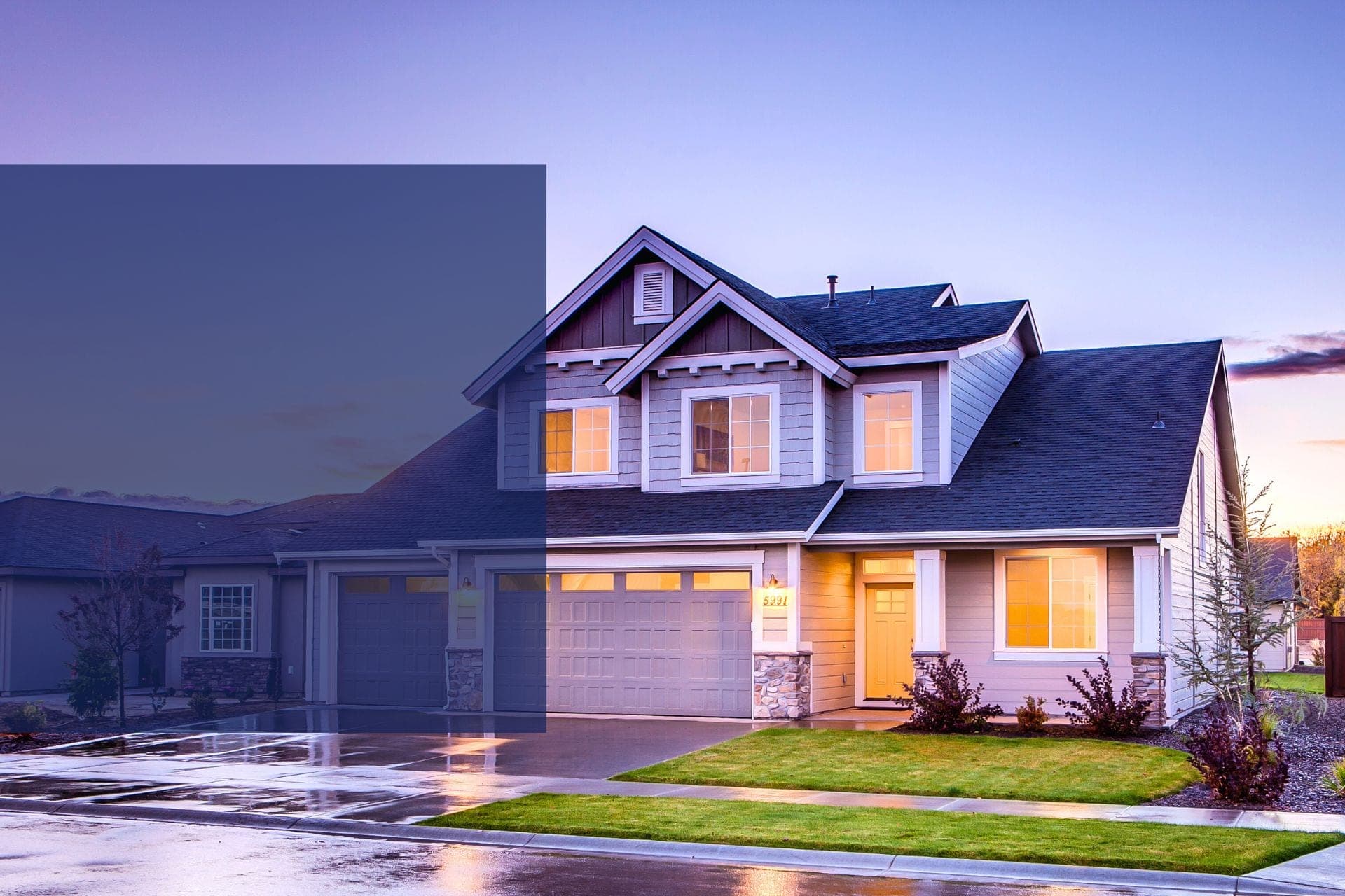 Beautiful blue house exterior painted by Mission Painting at dusk